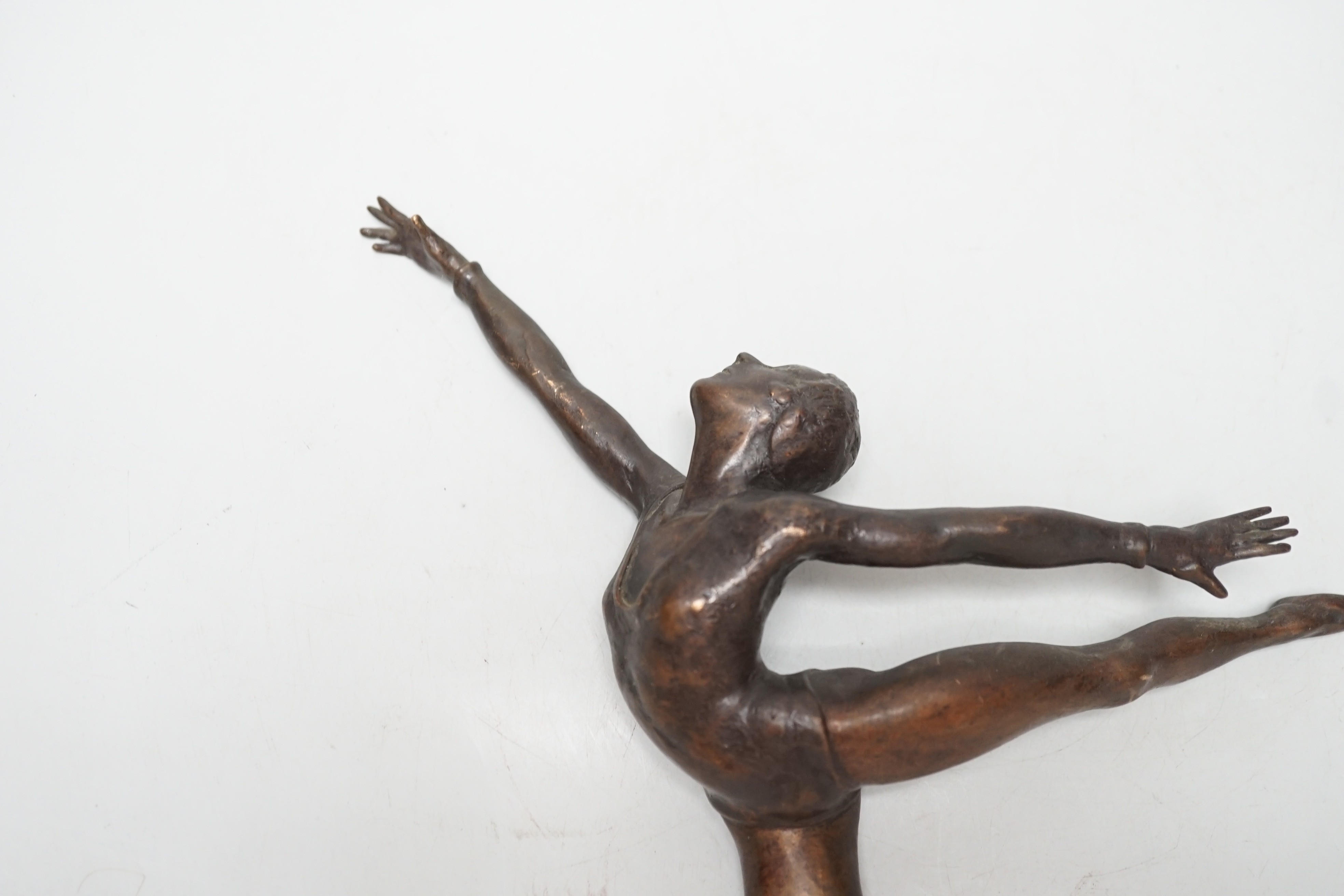 A bronze sculpture of a ballerina. 26cm wide